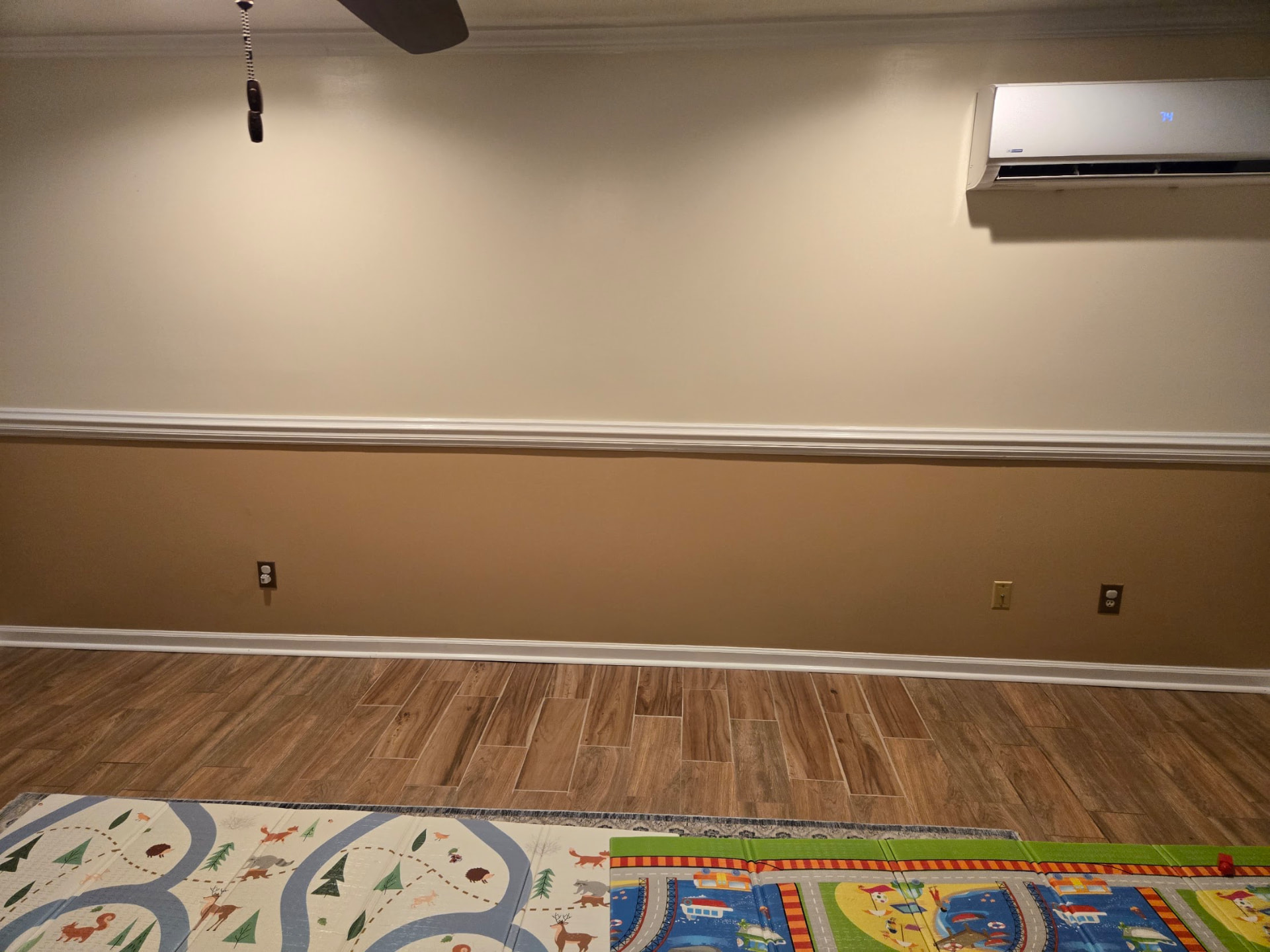 Installed wood-look flooring and baseboards in a family room