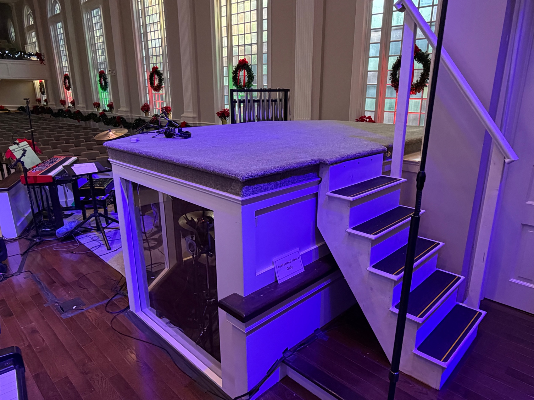 Finished commercial carpet installed on a church platform with stairs